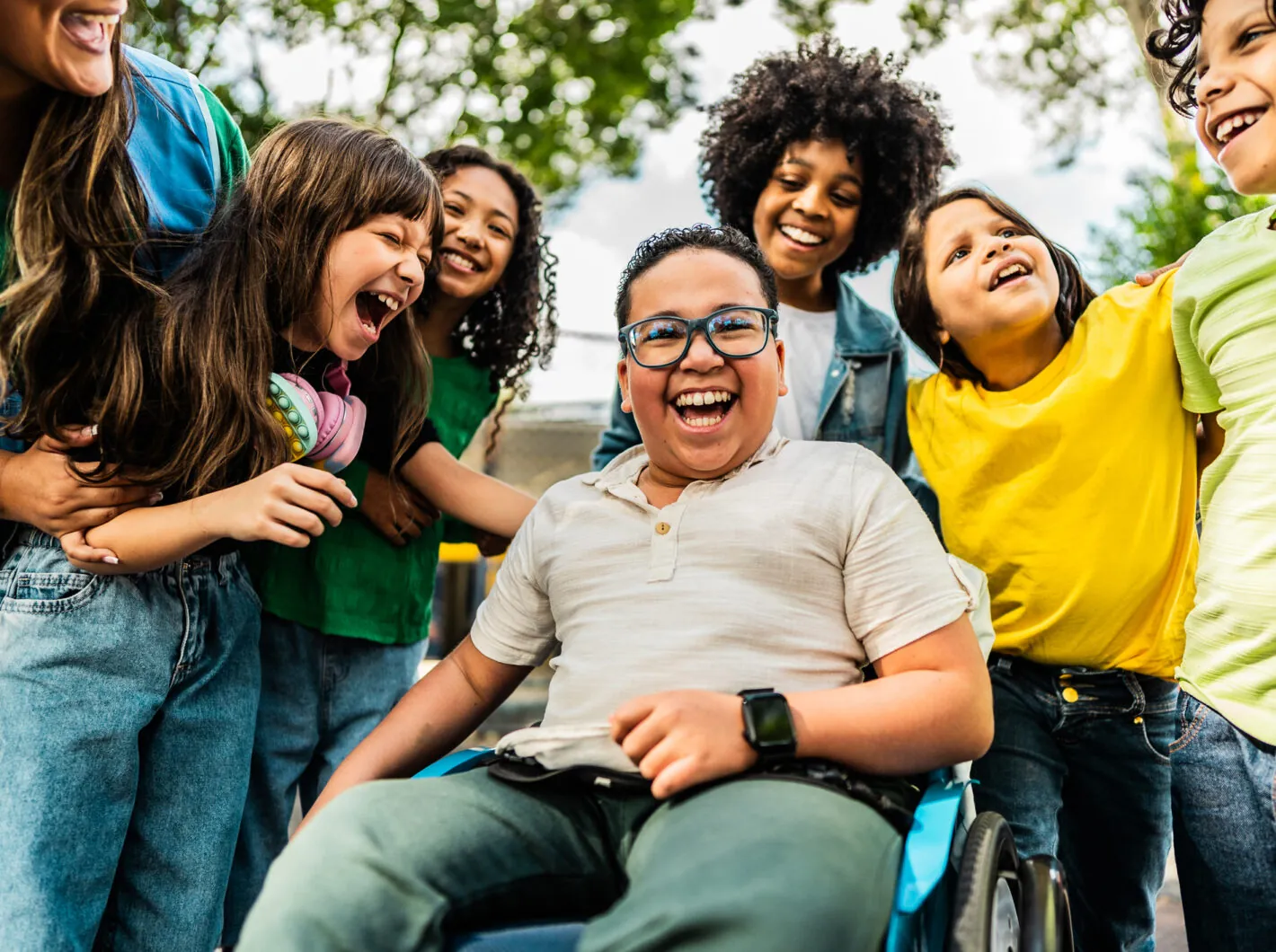 Children smiling and laughing outdoors