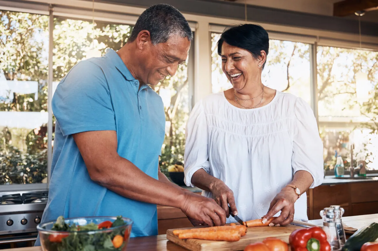 Photo of a happy couple cooking together
