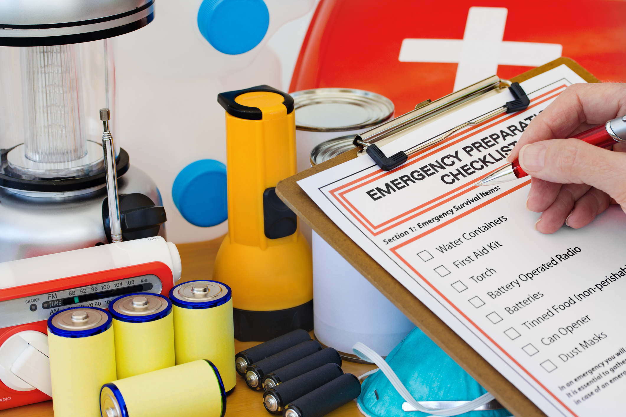 Photo of an emergency preparedness kit including flashlight and batteries