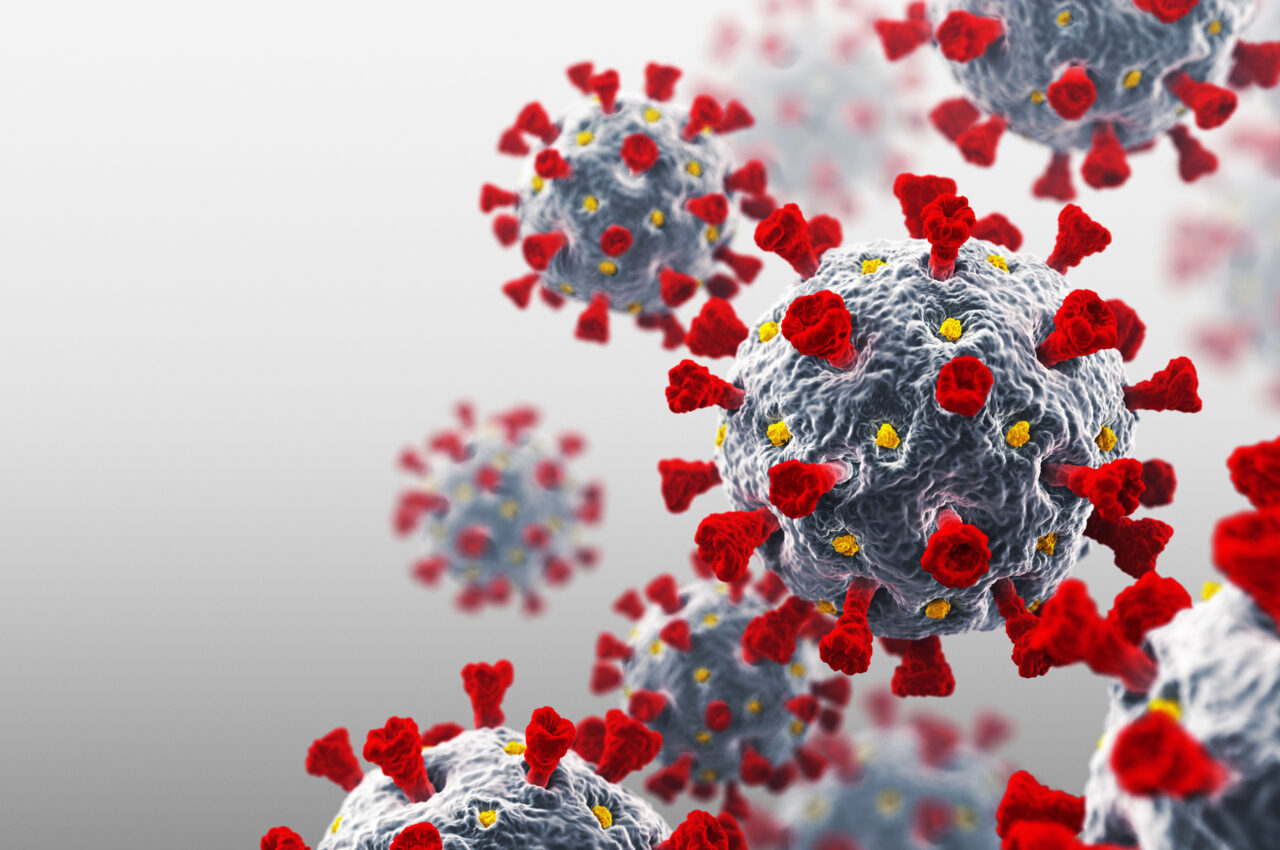 Illustration of coronavirus particles with red spikes and grey surfaces